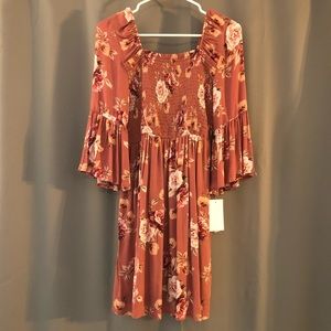 Rose colored dress with floral pattern and sleeves